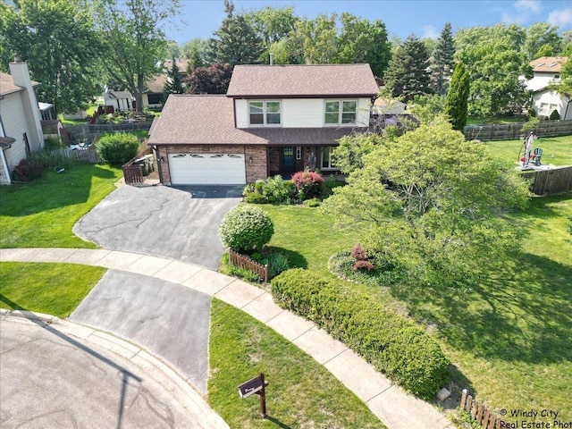 590 Woodcrest Ct, Carol Stream, IL 60188 - traditional-style home featuring driveway, a garage, and brick siding