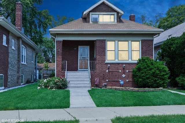1404 W 97th St, Chicago, IL 60643 - bungalow with a front yard, a chimney, and brick siding