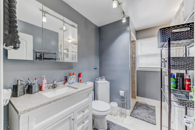 7740 Monitor Ave, Burbank, IL 60459 - full bathroom with vanity, track lighting, and tile patterned flooring