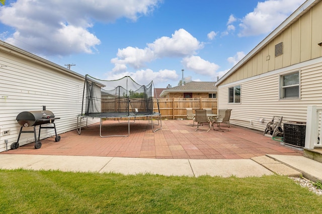 7740 Monitor Ave, Burbank, IL 60459 - view of patio with a grill and a trampoline