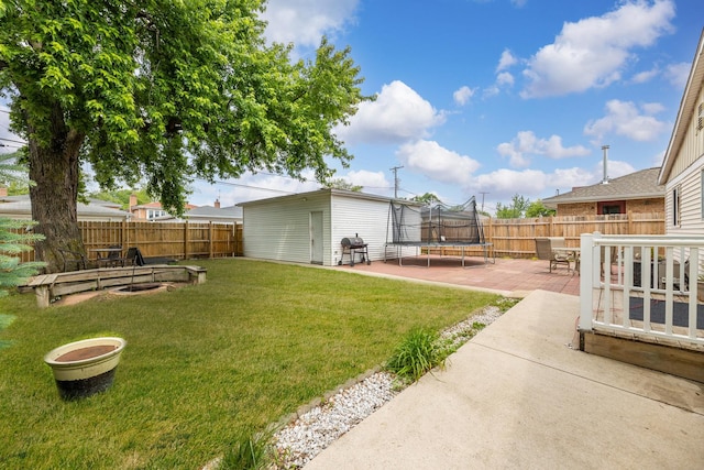 7740 Monitor Ave, Burbank, IL 60459 - fenced backyard with a trampoline, an outdoor structure, and a patio