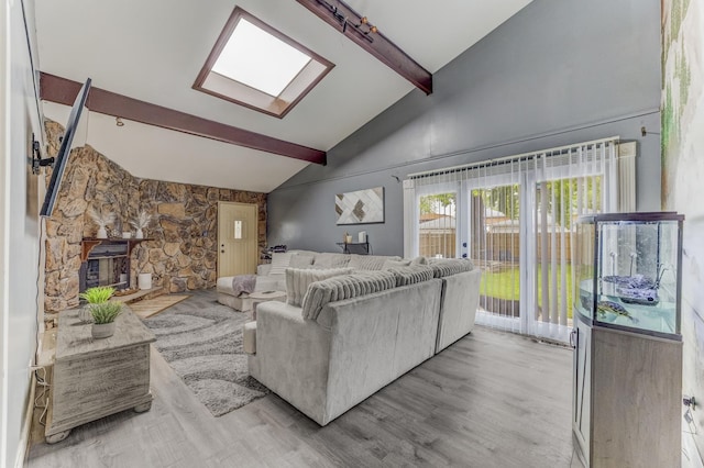 7740 Monitor Ave, Burbank, IL 60459 - living area featuring a skylight, beam ceiling, wood finished floors, and high vaulted ceiling