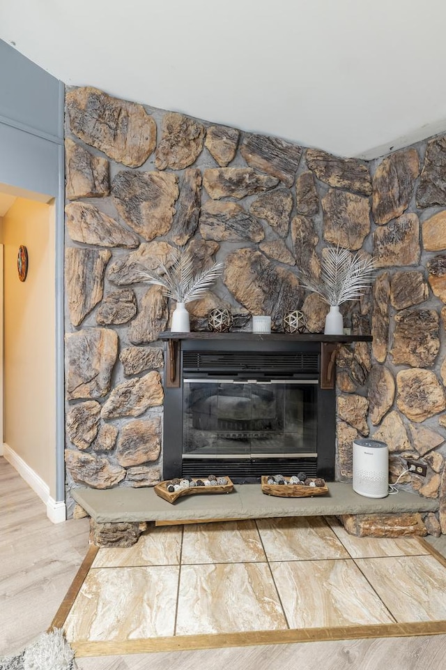 7740 Monitor Ave, Burbank, IL 60459 - detailed view of wood finished floors and a stone fireplace