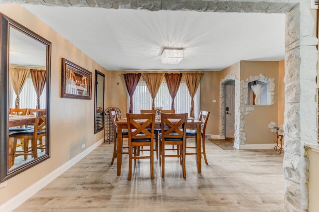 7740 Monitor Ave, Burbank, IL 60459 - dining room featuring light wood-style floors and baseboards