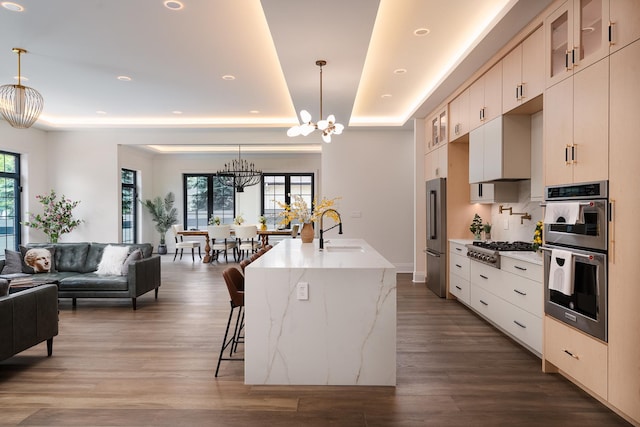 1847 Dexter Ln, Des Plaines, IL 60018 - kitchen featuring a chandelier, a raised ceiling, stainless steel appliances, wood finished floors, and recessed lighting