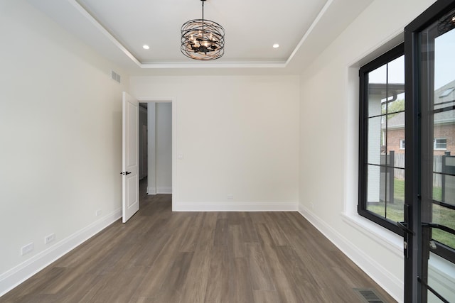 1847 Dexter Ln, Des Plaines, IL 60018 - spare room with dark wood-style floors, a raised ceiling, a chandelier, and recessed lighting