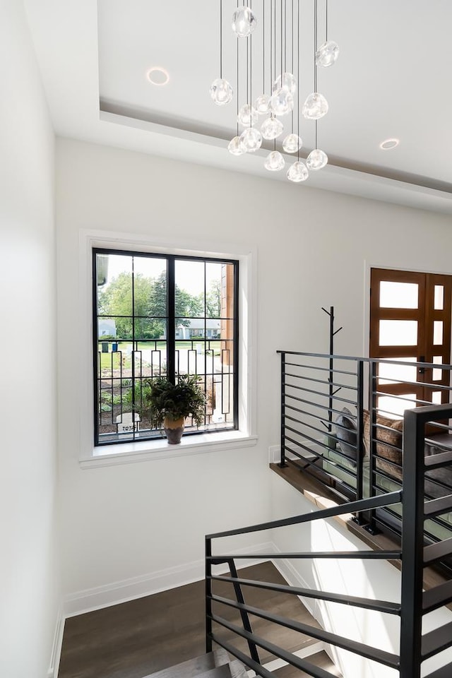 1847 Dexter Ln, Des Plaines, IL 60018 - stairway featuring wood finished floors and a tray ceiling