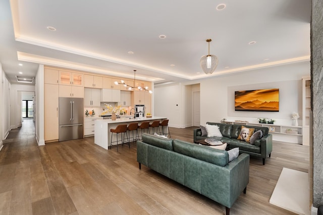 1847 Dexter Ln, Des Plaines, IL 60018 - living area featuring a chandelier, a tray ceiling, dark wood-style flooring, and recessed lighting