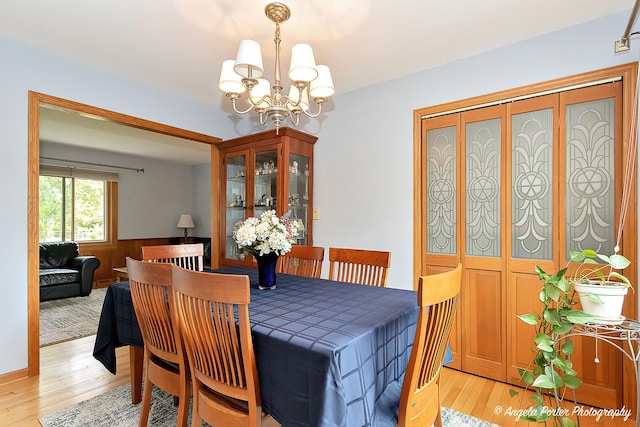 702 W Broadway St, Mchenry, IL 60051 - dining area featuring a chandelier and light wood-style floors