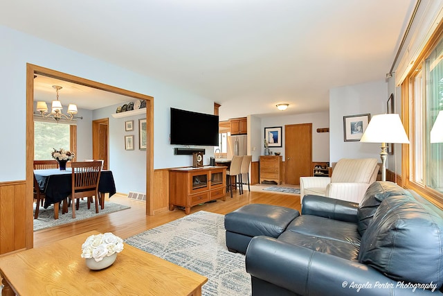 702 W Broadway St, Mchenry, IL 60051 - living area featuring a chandelier and light wood-style flooring