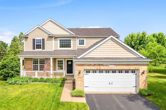 4553 Gardiner Ave, Yorkville, IL 60560 - view of front facade with brick siding, a porch, asphalt driveway, a front lawn, and a shingled roof