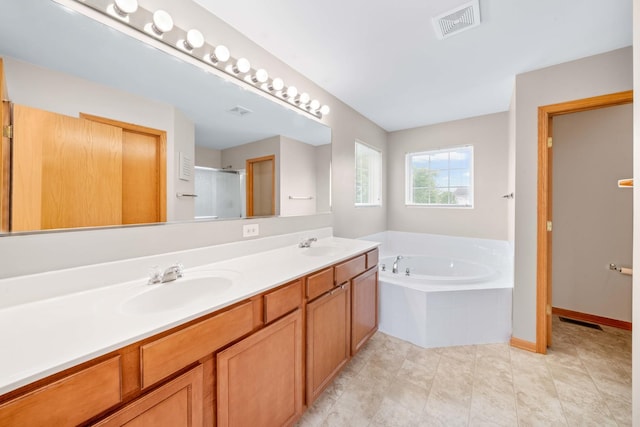 4553 Gardiner Ave, Yorkville, IL 60560 - full bathroom featuring double vanity, a garden tub, a shower stall, and tile patterned floors