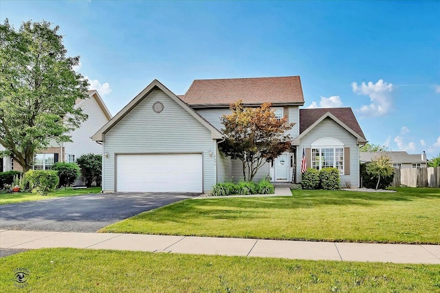 5692 W Roosevelt St, Monee, IL 60449 - traditional home featuring asphalt driveway and an attached garage