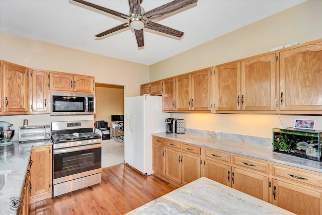 5692 W Roosevelt St, Monee, IL 60449 - kitchen with stainless steel appliances, a ceiling fan, and light wood-type flooring
