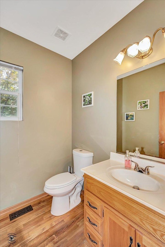 5692 W Roosevelt St, Monee, IL 60449 - half bath featuring vanity and wood finished floors