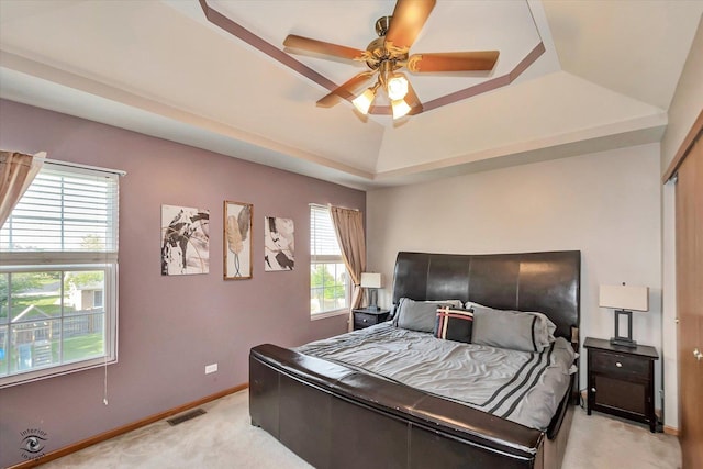 5692 W Roosevelt St, Monee, IL 60449 - bedroom featuring light colored carpet, a raised ceiling, and a ceiling fan