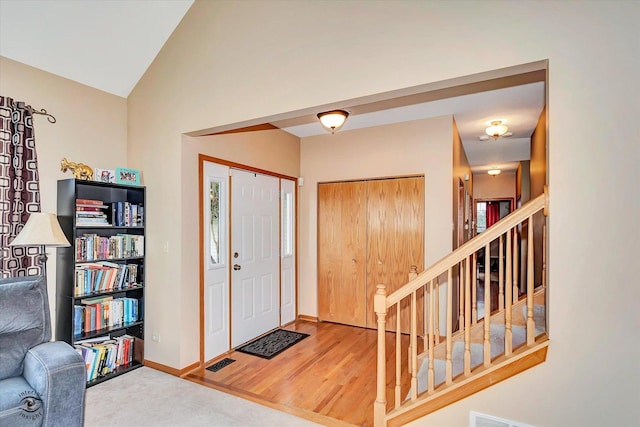 5692 W Roosevelt St, Monee, IL 60449 - foyer with stairway, lofted ceiling, and carpet flooring