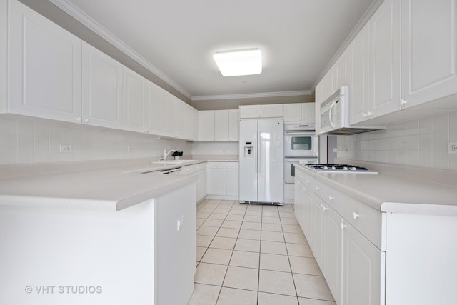 800 Weidner Rd Unit 307, Buffalo Grove, IL 60089 - kitchen featuring white appliances, light tile patterned floors, a peninsula, decorative backsplash, and white cabinetry