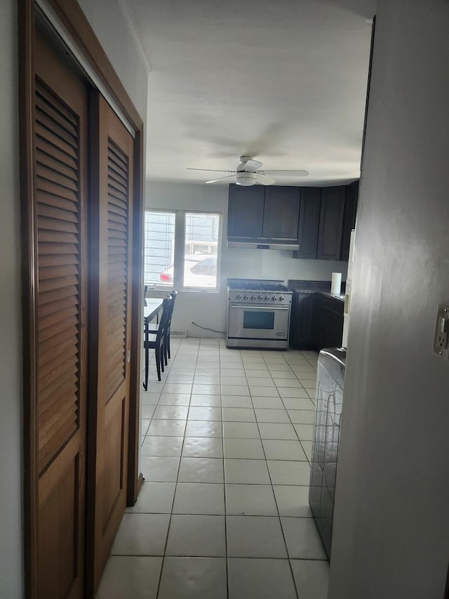 109 S Elm St, Palatine, IL 60067 - kitchen with stainless steel stove, ceiling fan, and light tile patterned floors