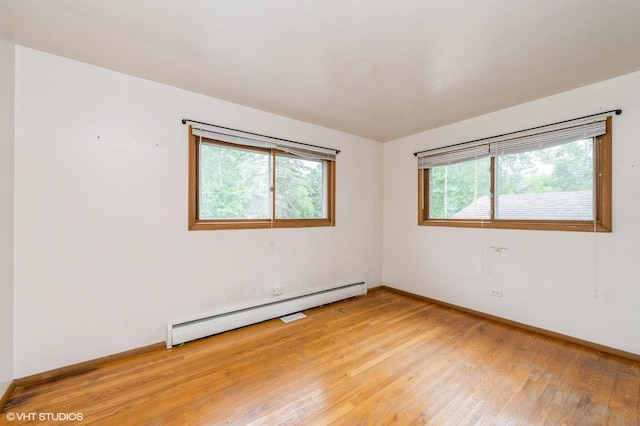 4321 Bay View Dr, Crystal Lake, IL 60014 - unfurnished room featuring baseboard heating and light wood-type flooring