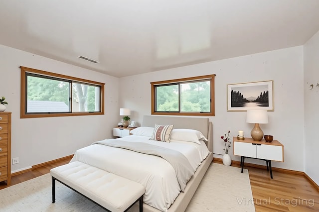 4321 Bay View Dr, Crystal Lake, IL 60014 - bedroom featuring light wood-type flooring and multiple windows
