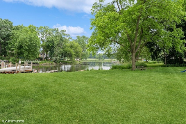 4321 Bay View Dr, Crystal Lake, IL 60014 - view of grassy yard featuring a water view and a boat dock