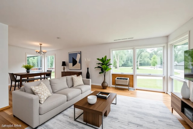 4321 Bay View Dr, Crystal Lake, IL 60014 - living area featuring a chandelier and light wood-style flooring
