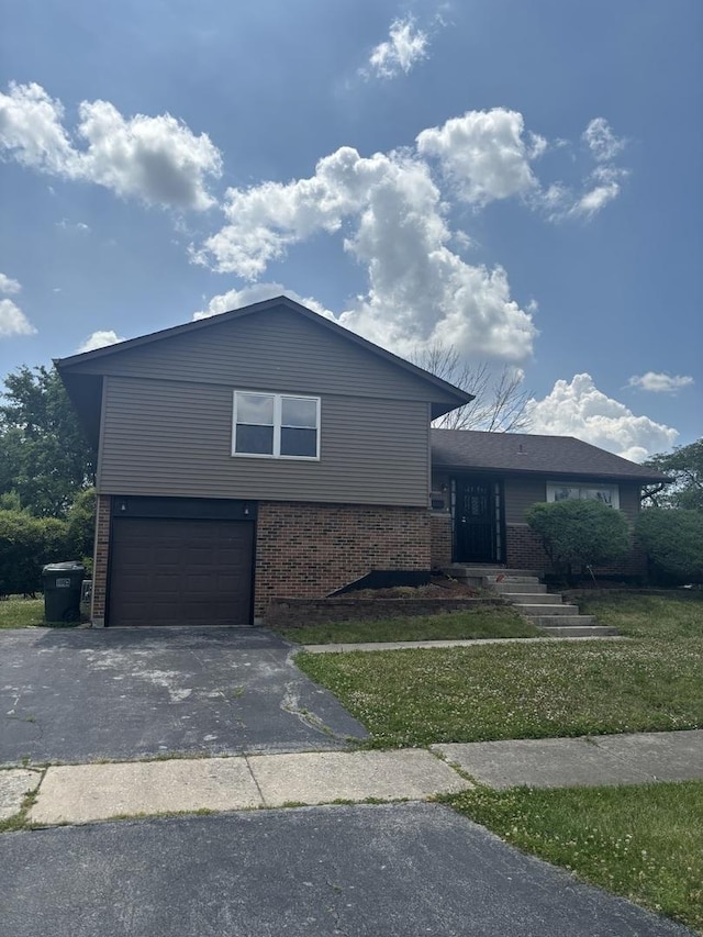 3501 Fountainbleau Dr, Hazel Crest, IL 60429 - view of front of property featuring brick siding, a garage, driveway, and a front lawn