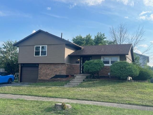3501 Fountainbleau Dr, Hazel Crest, IL 60429 - split level home featuring brick siding, driveway, an attached garage, and a front lawn