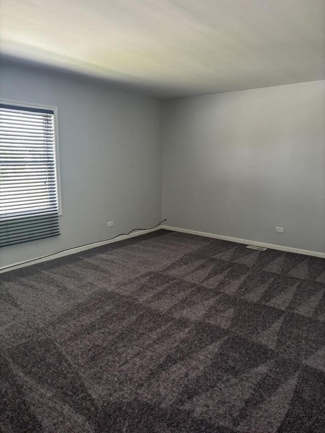 3501 Fountainbleau Dr, Hazel Crest, IL 60429 - spare room with dark colored carpet