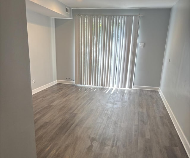 3501 Fountainbleau Dr, Hazel Crest, IL 60429 - unfurnished room with dark wood-style floors and baseboards