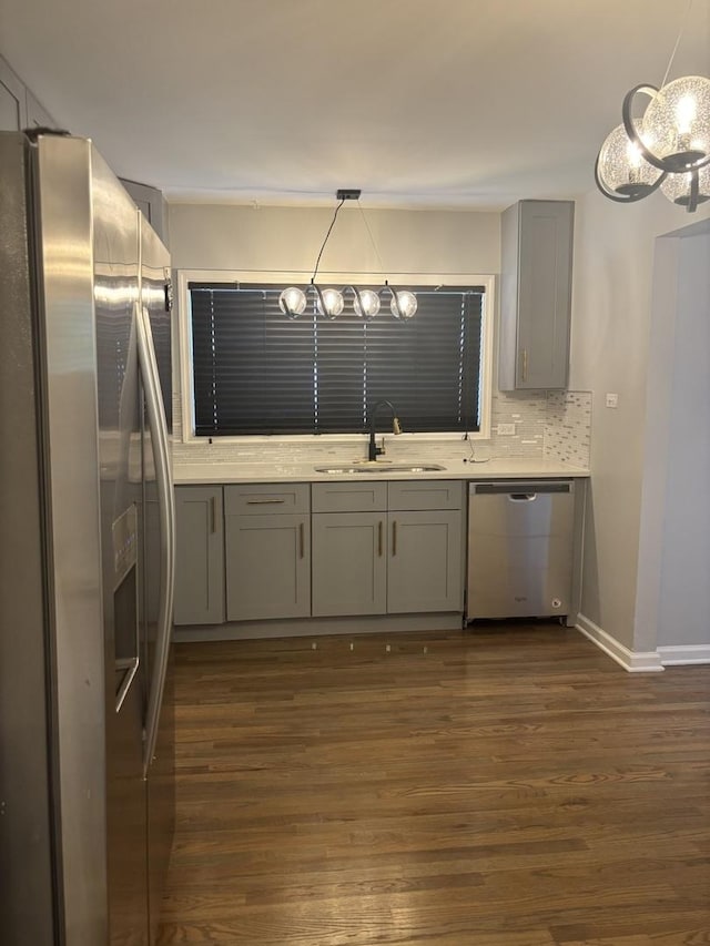 3501 Fountainbleau Dr, Hazel Crest, IL 60429 - kitchen featuring stainless steel appliances, gray cabinetry, dark wood-style flooring, a chandelier, and light countertops