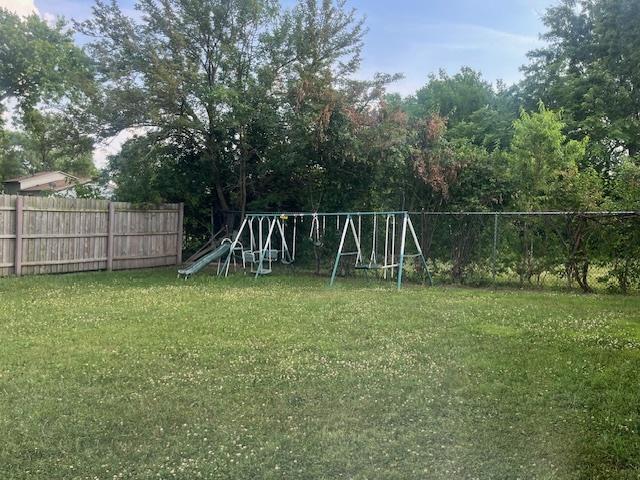 3501 Fountainbleau Dr, Hazel Crest, IL 60429 - fenced backyard with a playground