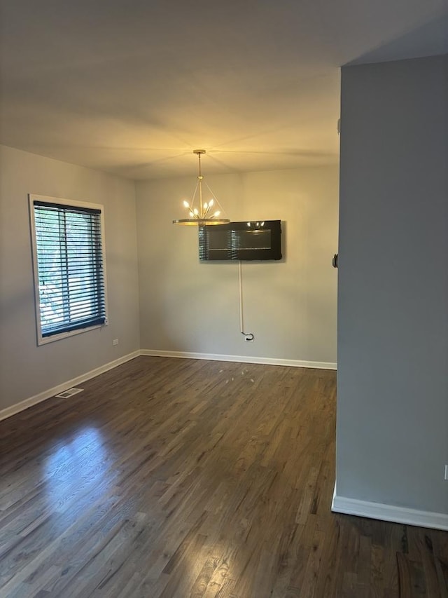 3501 Fountainbleau Dr, Hazel Crest, IL 60429 - spare room with a chandelier and dark wood-style floors
