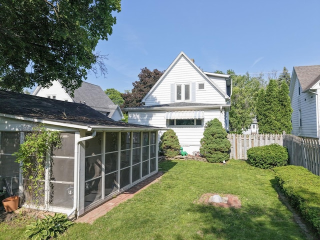 715 N 4th St, Dekalb, IL 60115 - back of house featuring a sunroom