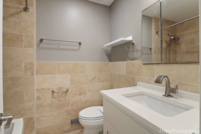 627 Bayview Pt, Schaumburg, IL 60194 - bathroom with tile walls, a tile shower, and vanity