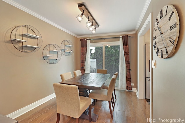 627 Bayview Pt, Schaumburg, IL 60194 - dining room with wood-type flooring and ornamental molding