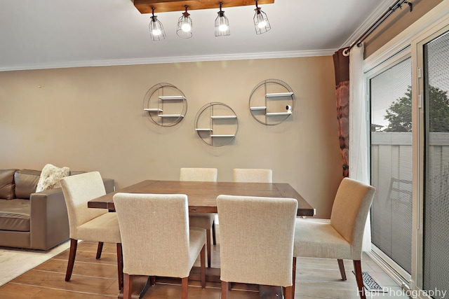 627 Bayview Pt, Schaumburg, IL 60194 - dining room featuring ornamental molding and wood finished floors