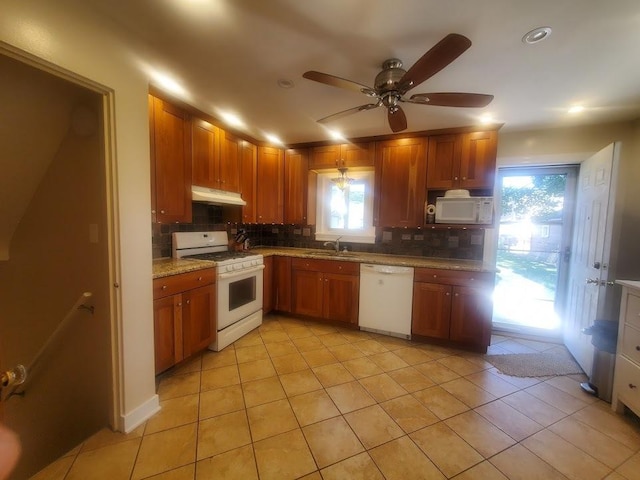 920 Hannah Ave, Forest Park, IL 60130 - kitchen featuring white appliances, under cabinet range hood, tasteful backsplash, light tile patterned floors, and recessed lighting