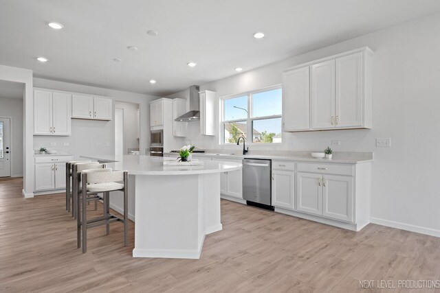 2308 Lawlor Ln, Naperville, IL 60564 - kitchen with dishwasher, wall chimney exhaust hood, white cabinets, a kitchen island, and light wood finished floors