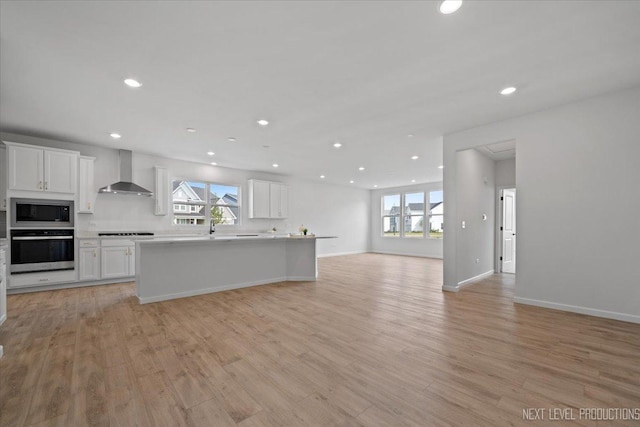 2308 Lawlor Ln, Naperville, IL 60564 - kitchen with appliances with stainless steel finishes, wall chimney exhaust hood, open floor plan, recessed lighting, and white cabinetry