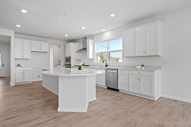 2308 Lawlor Ln, Naperville, IL 60564 - kitchen featuring appliances with stainless steel finishes, wall chimney range hood, a kitchen island, white cabinets, and light wood-type flooring