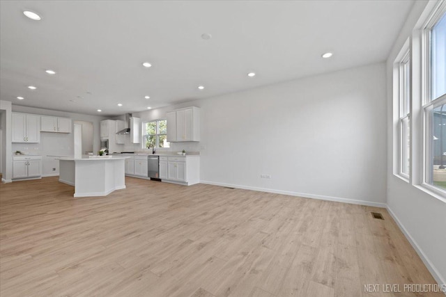 2308 Lawlor Ln, Naperville, IL 60564 - kitchen with stainless steel dishwasher, wall chimney exhaust hood, open floor plan, light wood-style flooring, and recessed lighting