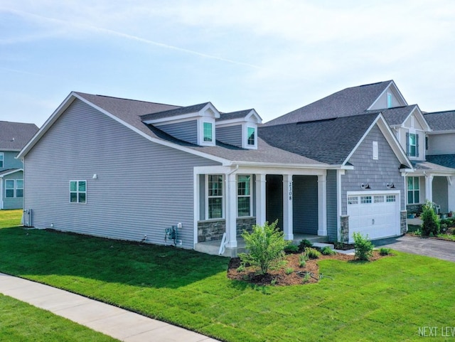 2308 Lawlor Ln, Naperville, IL 60564 - view of front of home featuring driveway, a front yard, a garage, a porch, and stone siding