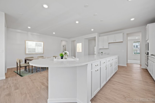 2308 Lawlor Ln, Naperville, IL 60564 - kitchen featuring white cabinetry, light wood-style flooring, light countertops, and recessed lighting