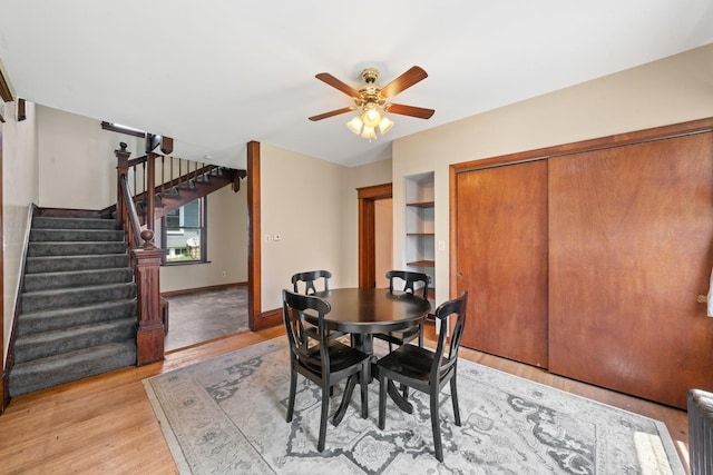 220 N Cedar St, Waterman, IL 60556 - dining area with a ceiling fan, stairs, light wood-style flooring, and built in features