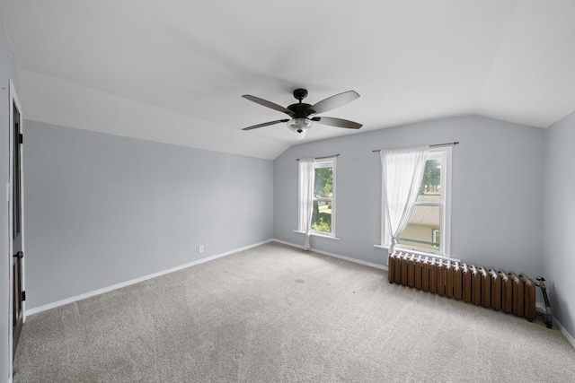 220 N Cedar St, Waterman, IL 60556 - additional living space with radiator heating unit, lofted ceiling, ceiling fan, and carpet floors