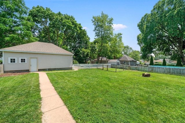 220 N Cedar St, Waterman, IL 60556 - fenced backyard with an outdoor structure