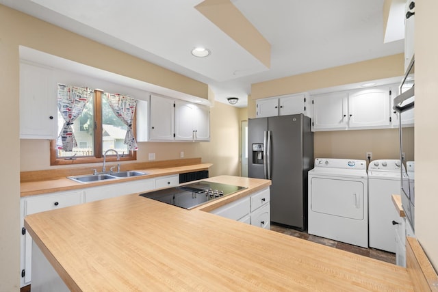 220 N Cedar St, Waterman, IL 60556 - kitchen with washing machine and dryer, black electric stovetop, stainless steel fridge with ice dispenser, white cabinetry, and recessed lighting