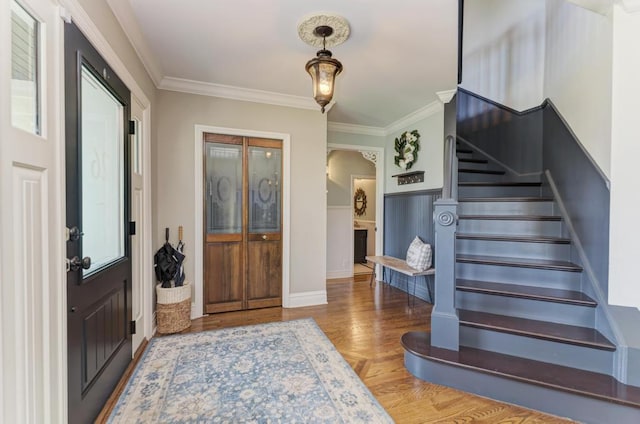 26 Carriage House Ln, Orland Park, IL 60467 - foyer featuring crown molding, stairs, arched walkways, and wood finished floors